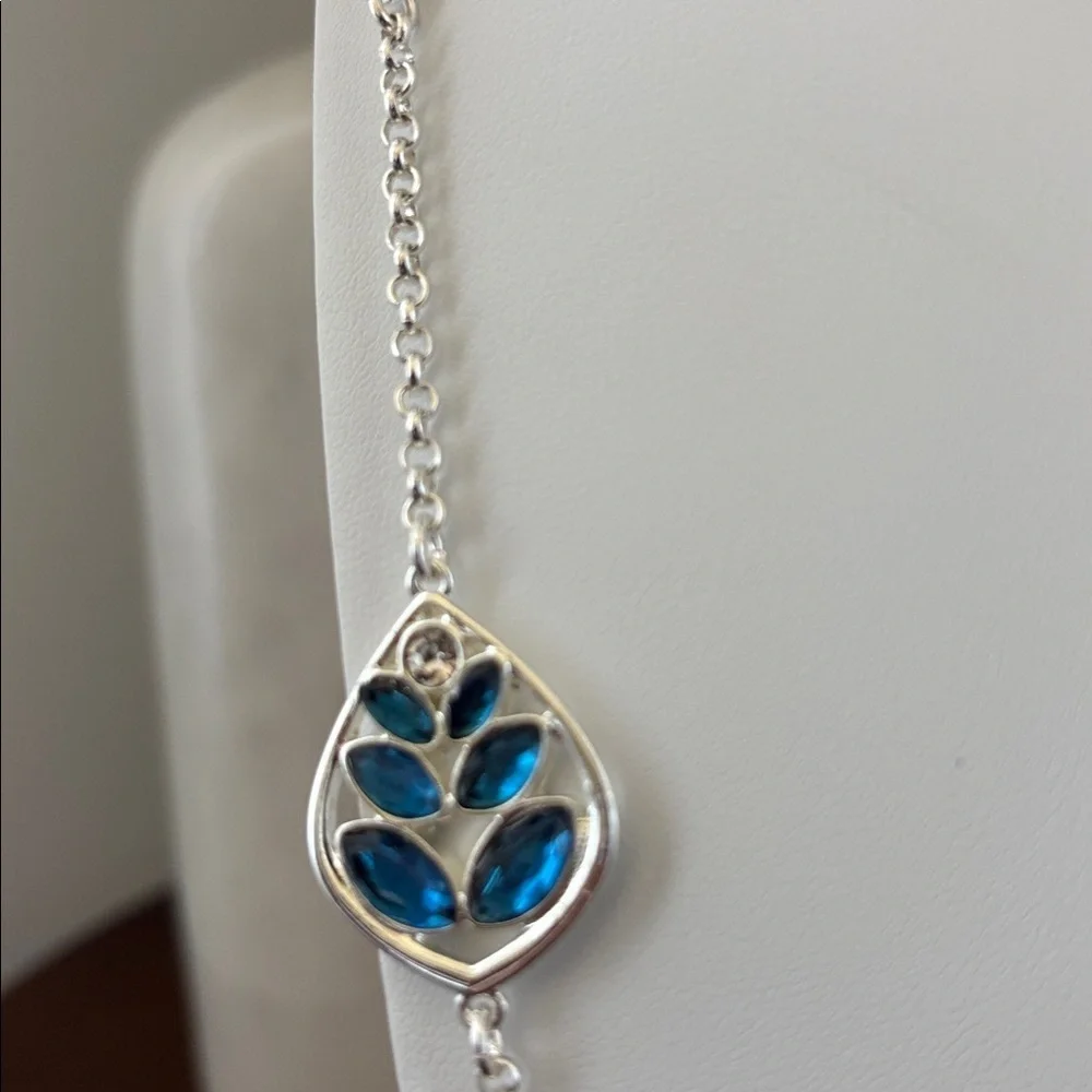 Gloria Vanderbilt Reversible Silvertone chain,teardrop w/blue & clear stones